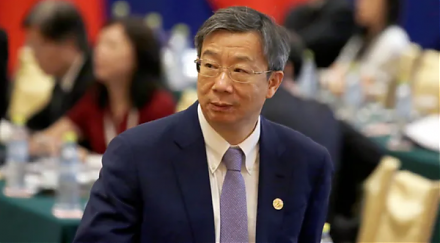 China allows its renminbi currency to slide below the psychologically important threshold of 7-yuan per U.S. dollar.